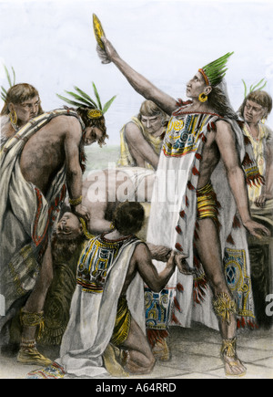 Aztec priest performing human sacrifice in ancient Mexico. Hand-colored photogravure of an illustration Stock Photo