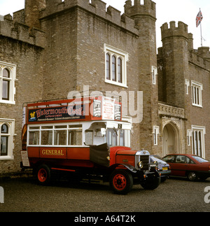 UK Devon Watermouth Castle entrance old red bus Stock Photo