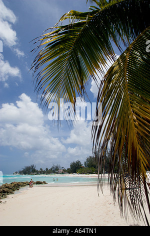 WEST INDIES Caribbean Barbados Christ Church Parish Rockley Beach also known as Accra Beach People on beach by sea defenses Stock Photo