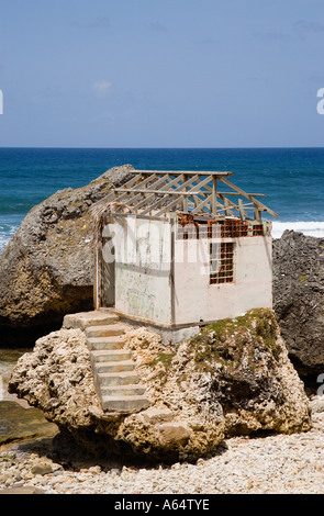 WEST INDIES Caribbean Barbados St Joseph Bathsheba Beach Ruined seaside house washed away from mainland still attached to rocks. Stock Photo