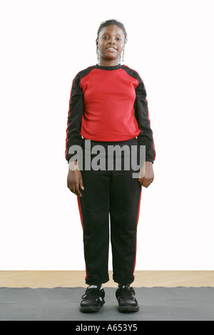 Full body view of an eleven year old girl standing. Stock Photo