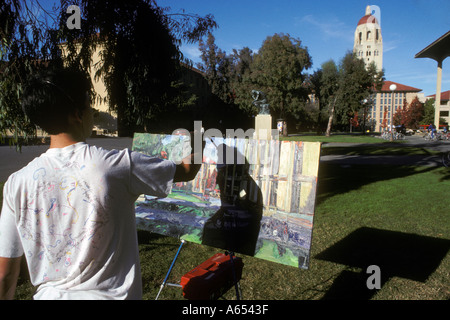 California Palo Alto Stanford University male student artist painting view toward Hoover Tower Stock Photo