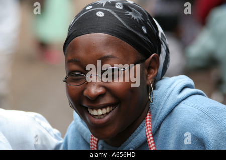 Young Kenyan woman in a fruit and vegetable market in Nairobi, Kenya Stock Photo