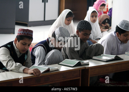 Muslim Students study the Koran inside the Kowloon Mosque and Islamic Center, Hong Kong, China Stock Photo