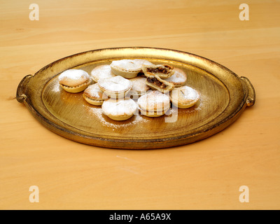 Home Baked Mince Pies with One Cut Open on Gold Platter Stock Photo