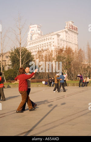 Dance group taking their early morning exercise. Shanghai, Peoples' Republic of China, Asia, Stock Photo