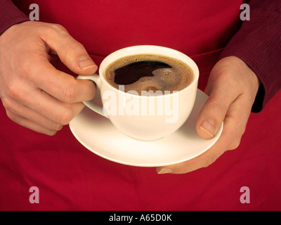 MAN HOLDING CUP OF BLACK COFFEE Stock Photo