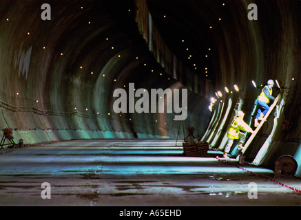 Two Rail Link Engineering construction workers clean the Channel Tunnel Stock Photo