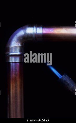 Copper Pipe And Elbow Being Heated Stock Photo