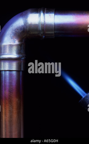 Copper Pipe And Elbow Being Heated Stock Photo