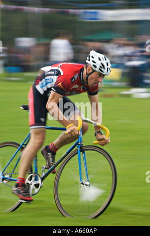 Bicyclist Racing in Highland Games Drumnadrochit Scotland Stock Photo