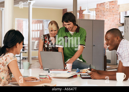 Four office workers having meeting. Stock Photo