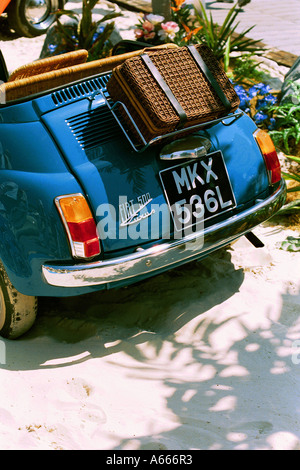 A Fiat 500 car with a picnic hamper on the boot rack Stock Photo