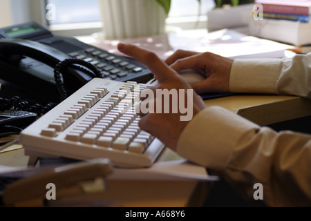 typing on a keyboard Stock Photo