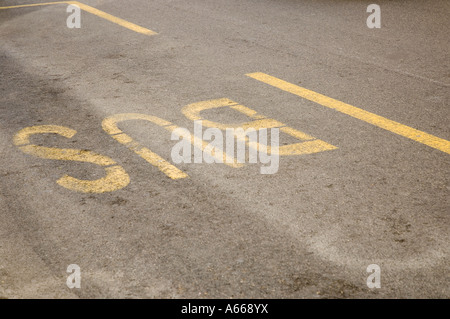 Bus Stop sign on road Stock Photo
