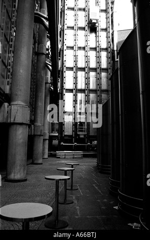 The staff chill out area and the lifts of lloyds of london shot in black and white Stock Photo