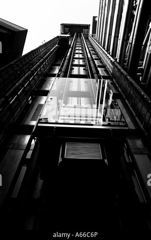 Lloyds of london in black and white with its lovely clean lifts on the outside of the insurance financial building Stock Photo