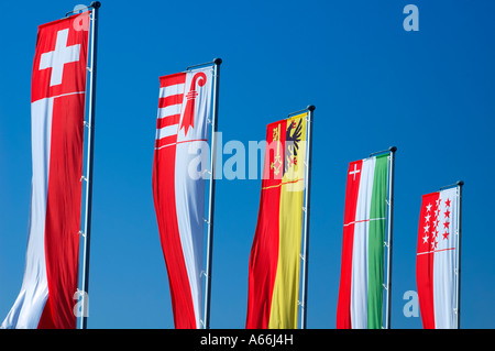 From left to right the banner of Switzerland and the banners of the cantons of Jura Geneva, Neuchatel and Valais Stock Photo
