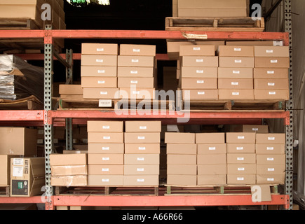 corrugated cardboard boxes on warehouse shelves Stock Photo