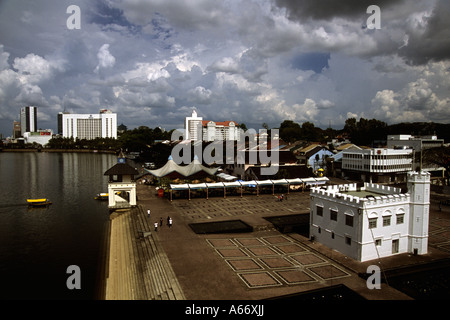 The waterfront,Kuching,Sarawak,Malaysia.Hilton Hotel in background.The square tower on right (1879) used to be a prison Stock Photo