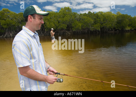 Fishermen try their luck in the mangrove waterways of Coongul Creek on the west coast of Fraser Island Stock Photo