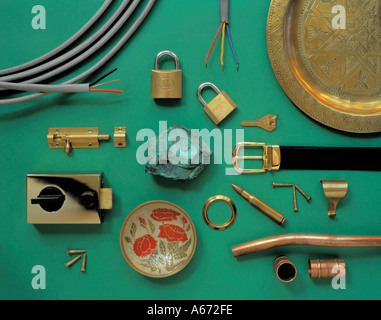 Sample of malachite and display of various objects made from copper and or copper alloys. Stock Photo