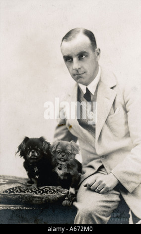 Man And Pekingese Stock Photo