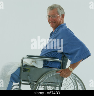 Mature man smiling in wheelchair Stock Photo