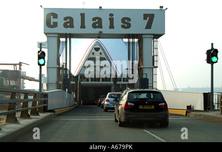 Cross Channel ferry with bow doors open Port of Calais northern France Cars embarking Stock Photo