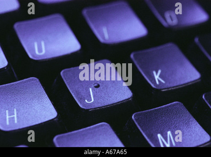 Computer keyboard under blue light Stock Photo