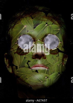 Idea nature concept Man s face made of leaves wearing sunglasses with cloud reflection Stock Photo