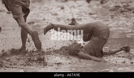 Woman falling in mud Woodstock music festival 1994 USA Stock Photo