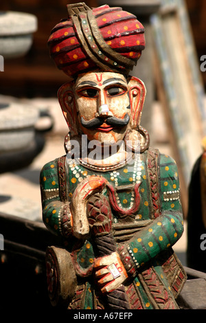 carved wooden Indian with turban  for sale to tourists in Fort Kochi Cochin Kerala India Stock Photo