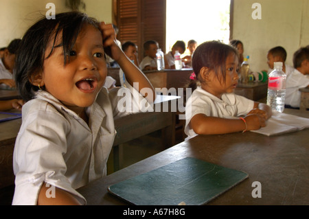 Khmer school children are studying in their classroom at the small Sras Srong school of Norkor Thom, Ankgor Wat, Cambodia. Stock Photo