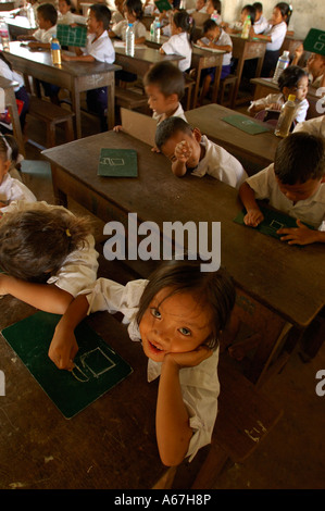 Khmer school children are studying in their classroom at the small Sras Srong school of Norkor Thom, Ankgor Wat, Cambodia. Stock Photo