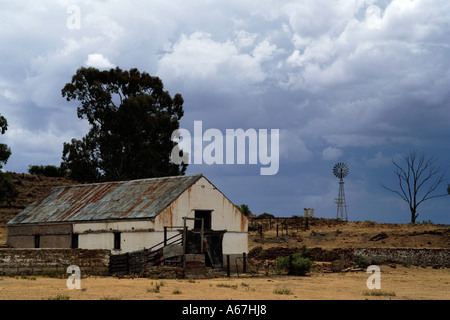 Storm clouds gather above abandoned farm Free State South Africa Stock Photo