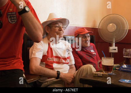 Older English World Cup football fans Southend on Sea Essex England  2006.  2000s drink ing beer through a straw HOMER SYKES Stock Photo