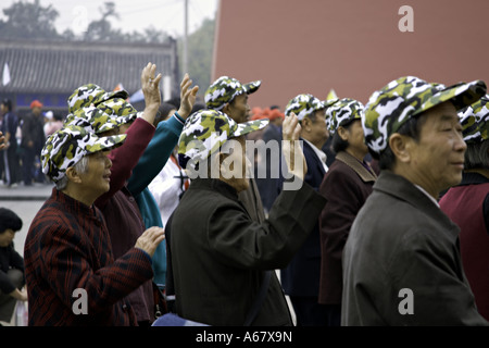 Chinese Tourist   Tourists With Baseball Caps   Sun Hat Taking A Photo 