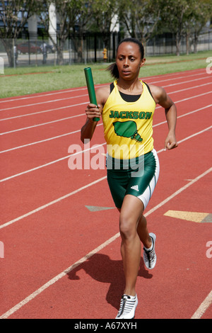 Miami Florida,Overtown,Booker T. Washington High School,campus,public school track meet,student students sporting competition,effort,ability,Black wom Stock Photo