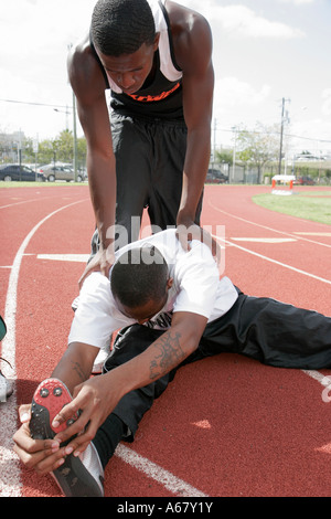 Miami Florida,Overtown,Booker T. Washington High School,campus,public school track meet,student students sporting competition,effort,ability,Black man Stock Photo