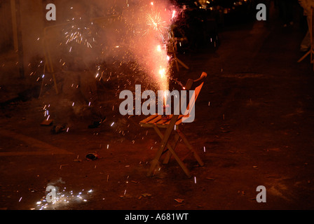 Sparkler blazing over a portable wooden chair during Las Crema event the last evening of Las Falles festival in the city of Valencia Spain Stock Photo