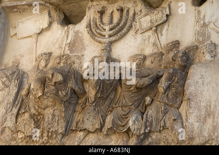 Relief depicts spoils taken from the Temple in Jerusalem carved at the south inner panel of Titus arch in the ancient Roman forum site, Rome Italy Stock Photo