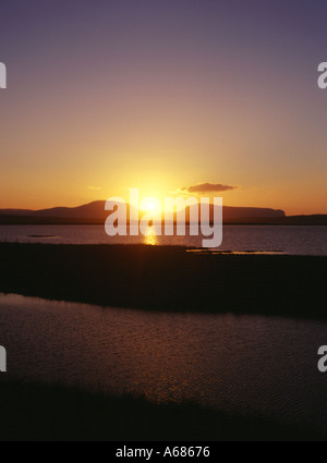 dh Loch of Harray STENNESS ORKNEY Hoy hills sunset winter solstice dusk midwinter golden sky uk Stock Photo