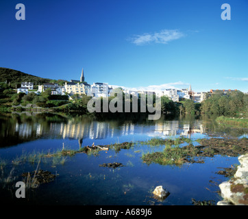 clifden village in connemara reflected on calm waters of sea inlet Stock Photo