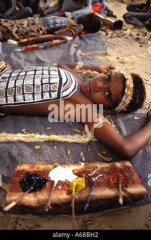 Aboriginal boys being painted with his totems for his initiation ceremony Arnhem Land by tribal elders Stock Photo