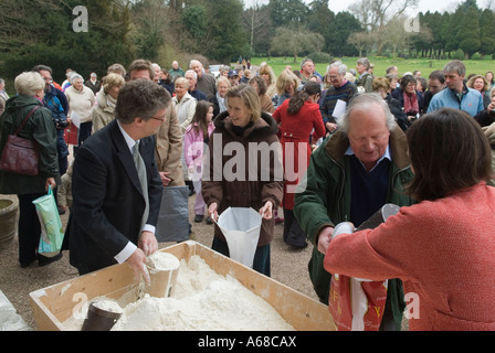 Tichborne Dole annually on Lady Day, March 25th Anthony and Catherine Loudon distributing dole flour. Tichborne, Alresford, Hampshire UK. 2007 2000s Stock Photo