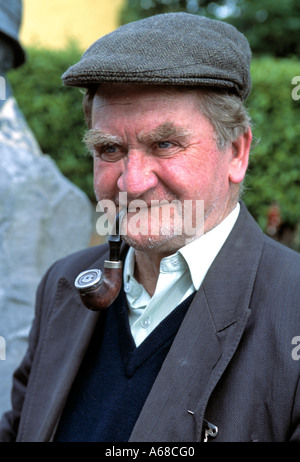 old elderly irish man person smoking a turn down pipe, senior citizen, Stock Photo