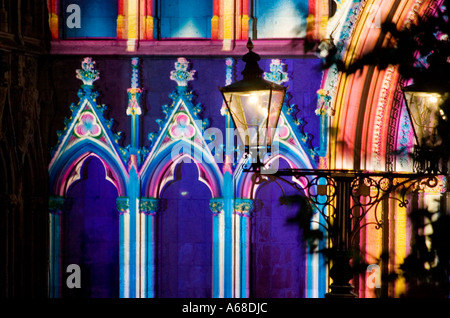 West door of York Minster illuminated in intricate colour during an event by French artist Patrice Warrener November 2005 Stock Photo