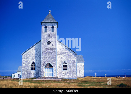 A weathered white church on Ile aux Marins, Saint Pierre et Miquelon Stock Photo