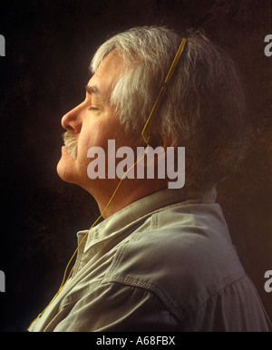Man listening to music with headphones Stock Photo